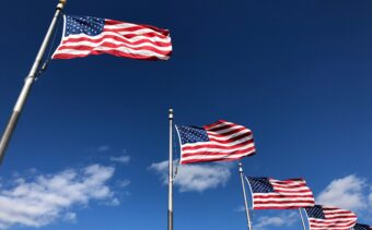 US challenger banks compliance: American flag on pole